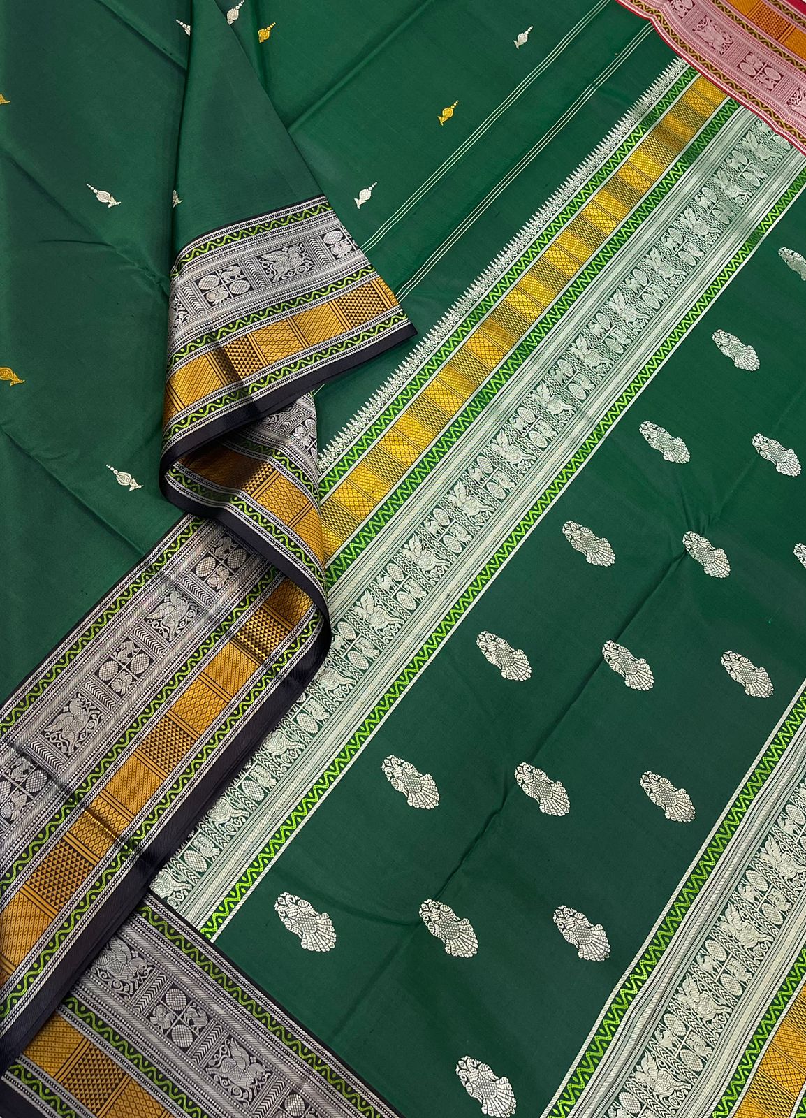 Pure Kanjivarams| Lotus bud BUTTA X Eruthalapakshi Pallu | Bottle green |Master weave x 4 Ply weave